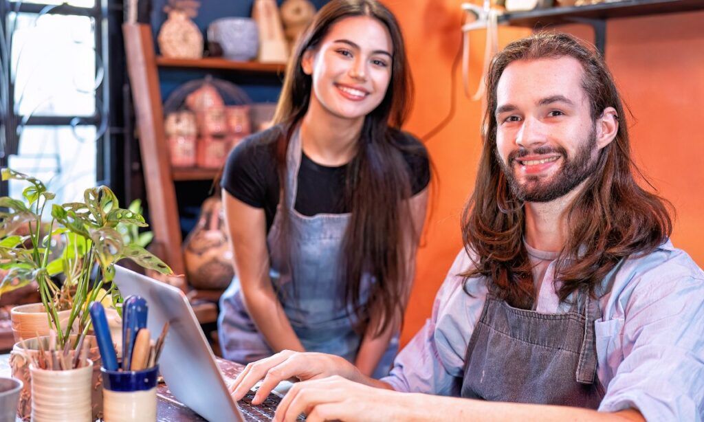 Man and Woman use laptop, happy smiling successful and running a business